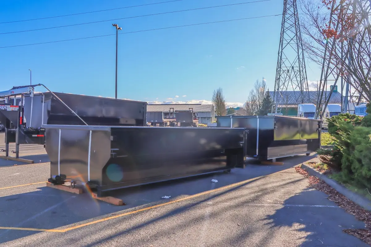 Roll-off dumpster ready for waste disposal at job site for Yard Waste Dumpster Rental in Oyster Bay